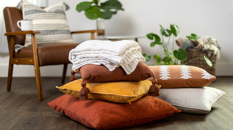 stacks of colorful, patterned pillows