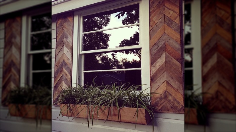 Wooden shutters with chevron pattern