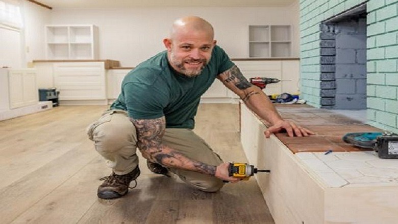 Joe Mazza installing fireplace