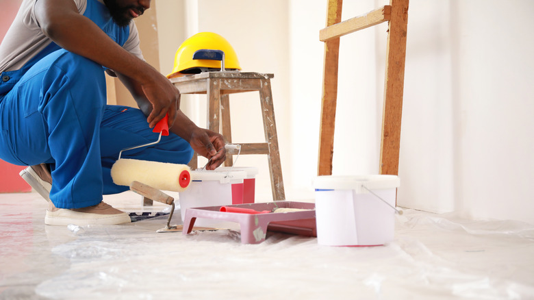 person preparing to repair walls