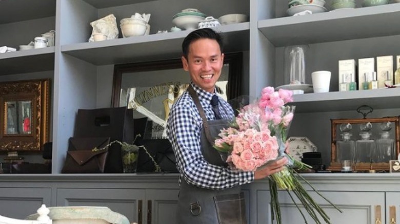 Jonathan Rachman holding flowers