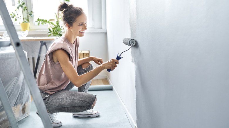 woman painting a wall