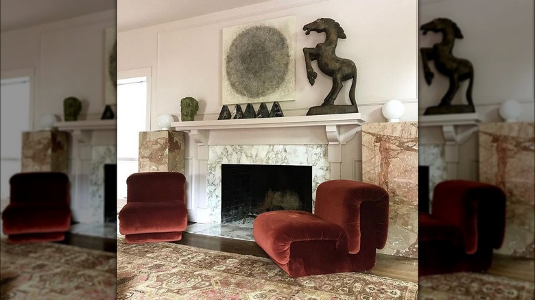 Mantel with horse statue and artwork