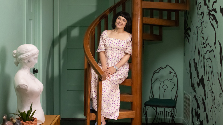 Katie Saro sitting on stairs