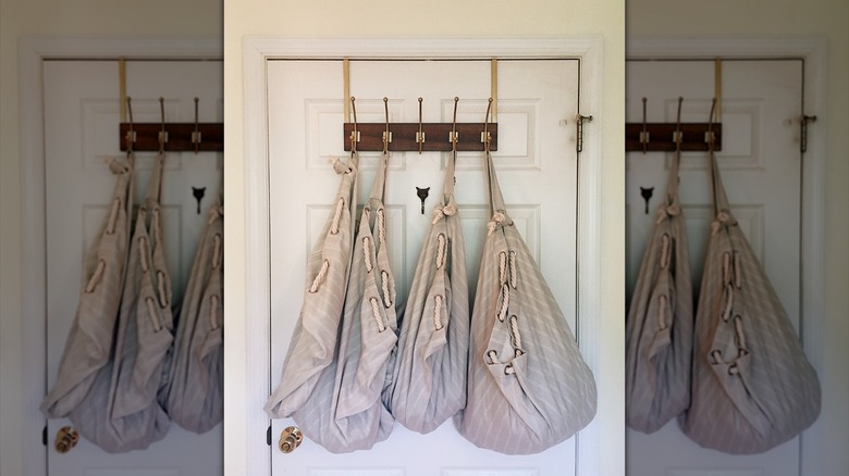 Laundry bags hanging from door