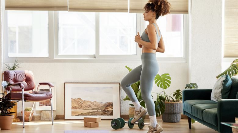 Woman exercising in her living room