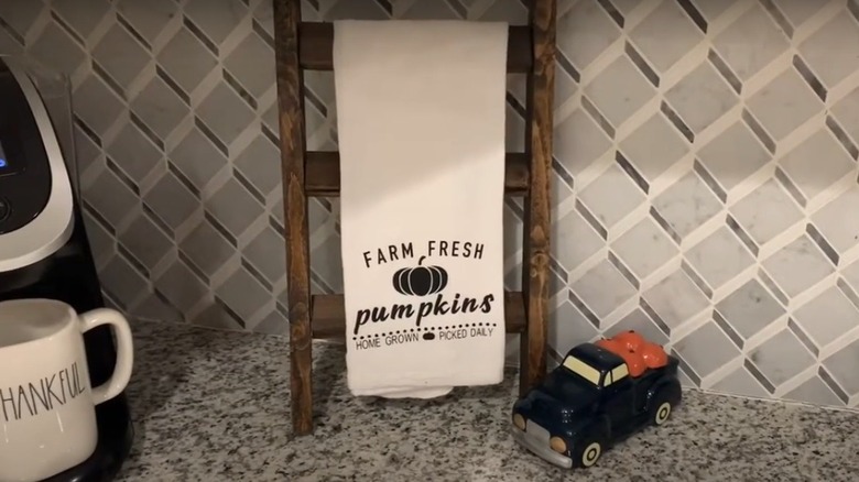 Fall themed towel on ladder