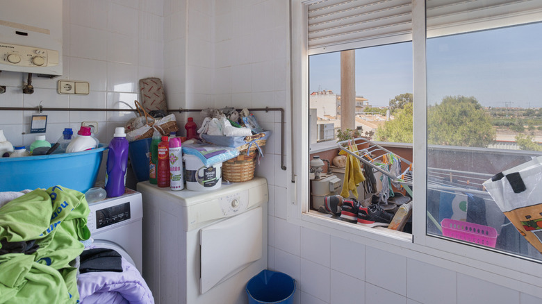 This messy laundry room is in dire need of organization.