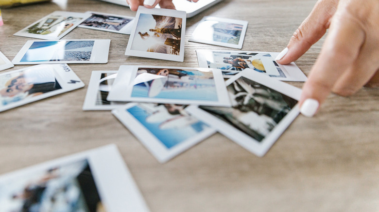 Person sorting photographs