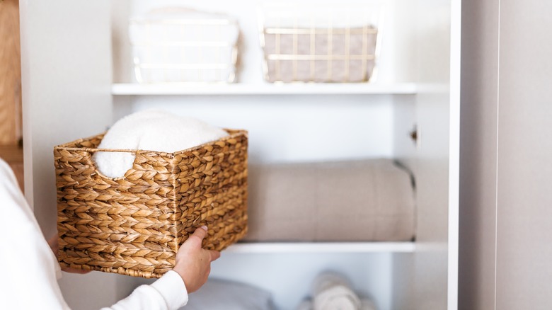 Shelf with towels and baskets