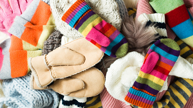 Pile of multicolored mittens, hats, and scarves