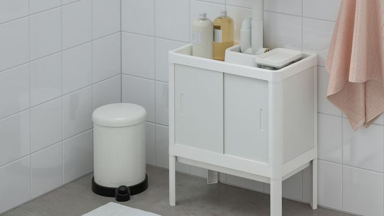 white pedestal cabinet in bathroom