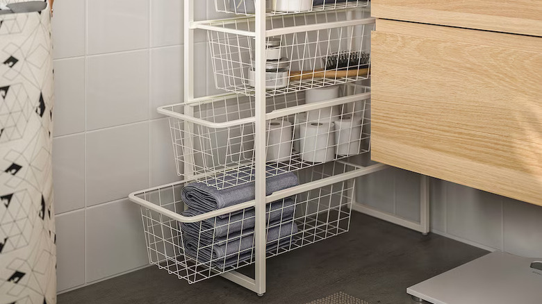 white storage baskets bathroom