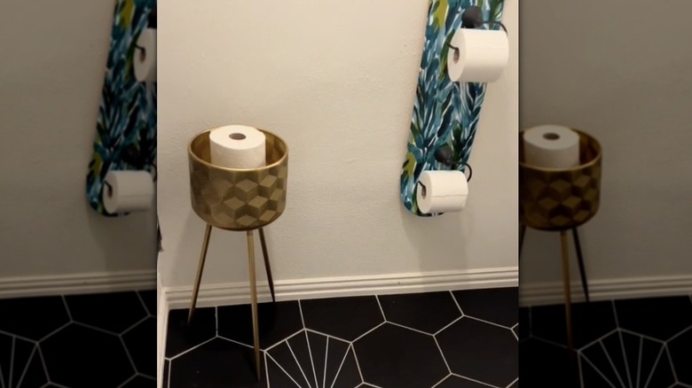 plant stand storing toilet paper