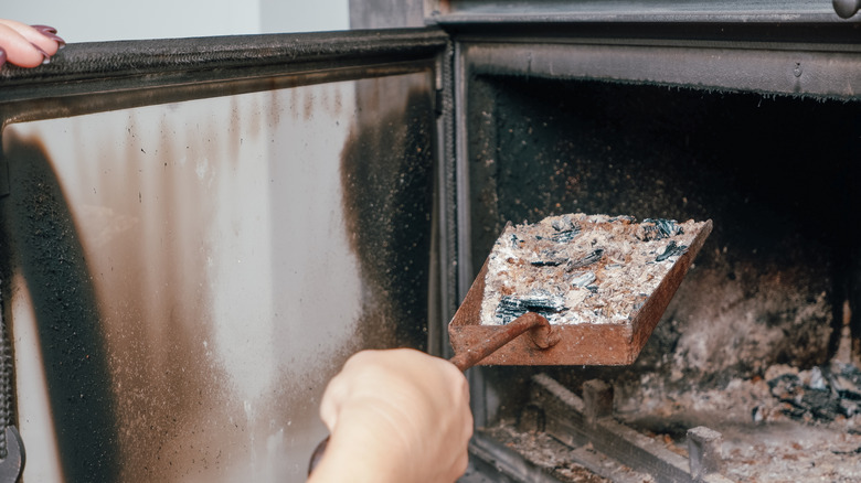 cleaning ash from a fireplace