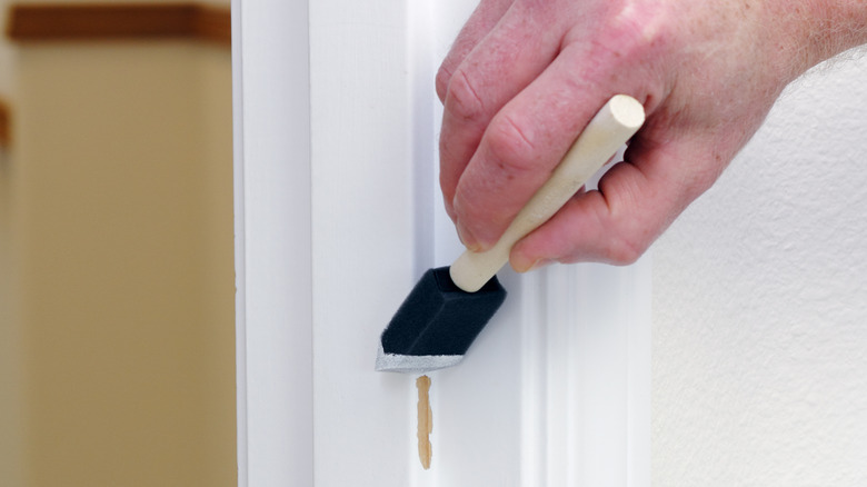 man doing touch-up painting