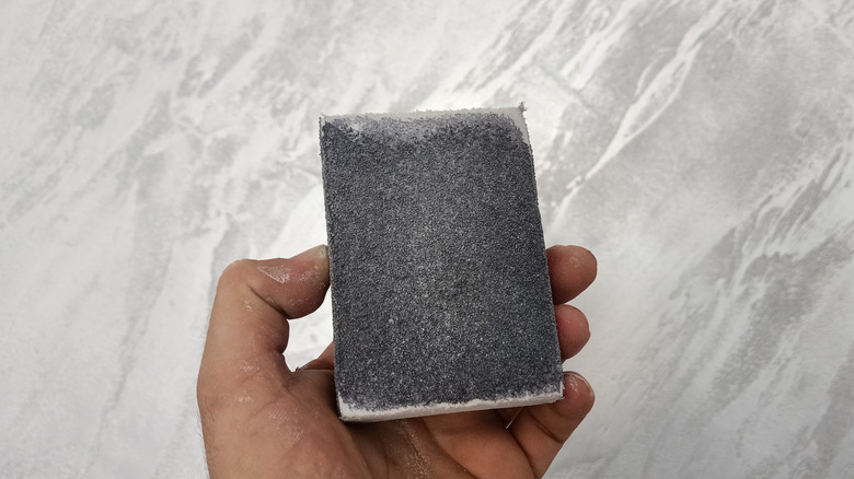 Sanding sponge in hand