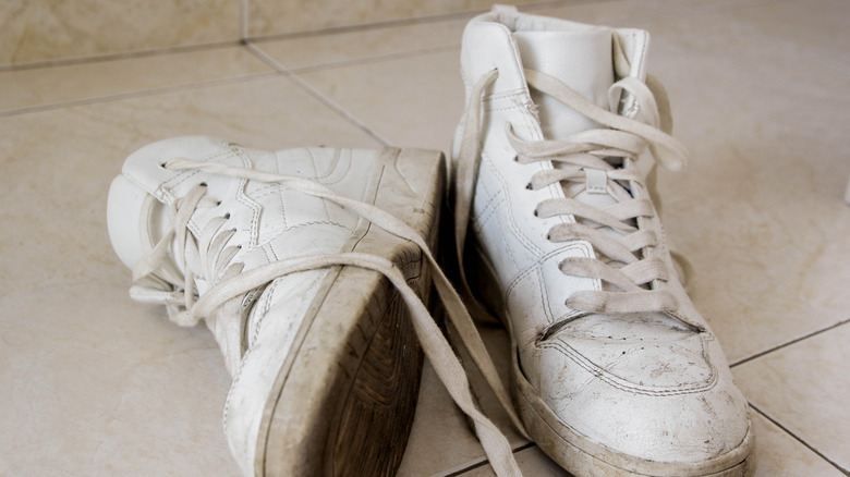 dirty sneakers on floor