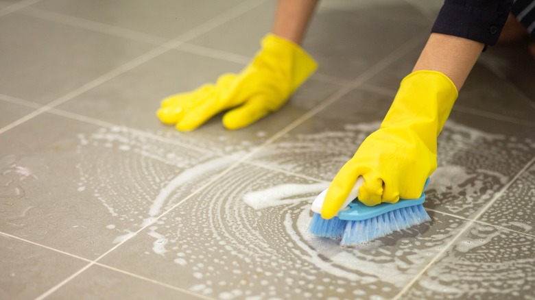 Scrubbing tiled floor