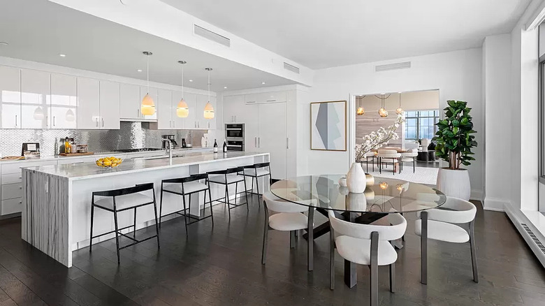 white kitchen and eating area 