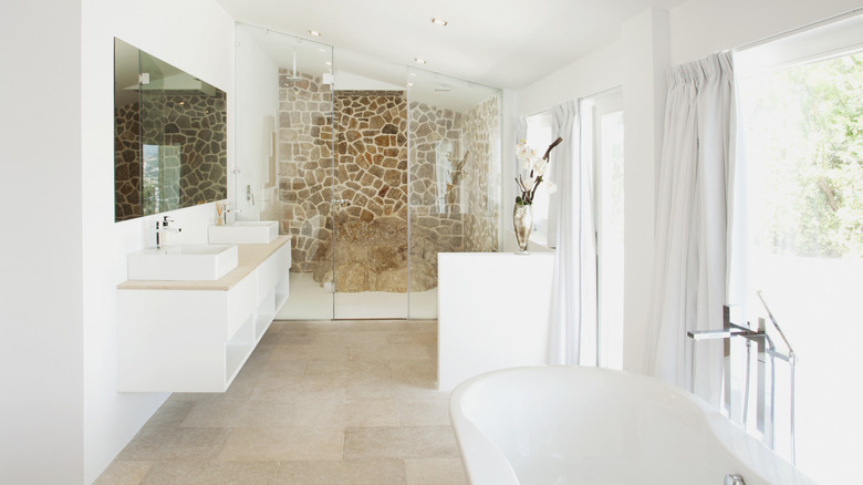 Mediterranean bathroom with stone