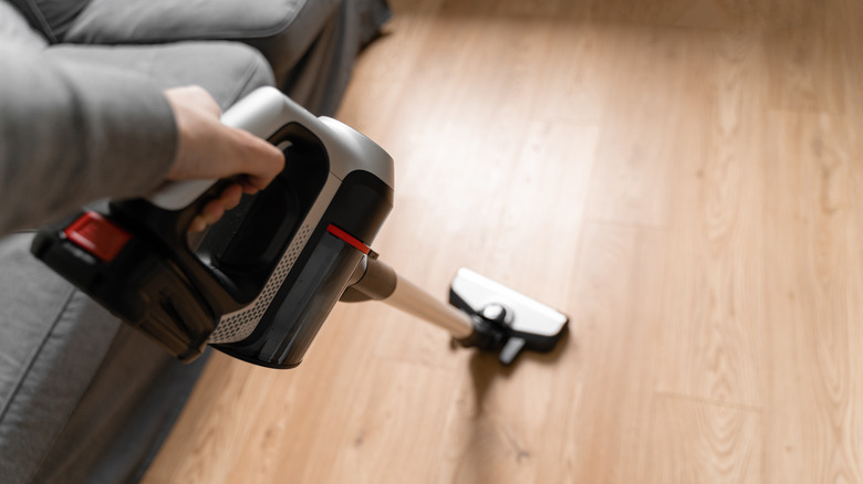 Cordless vacuum cleaner on hardwood floor