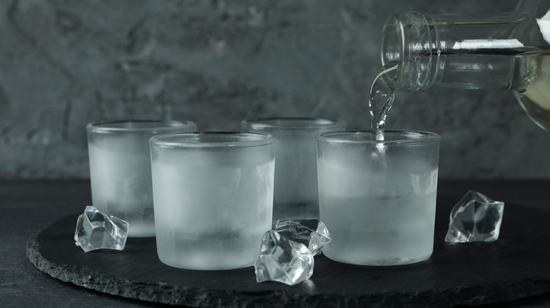 Vodka being poured into glasses