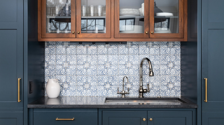 Blue tile used as kitchen backsplash in modern blue kitchen