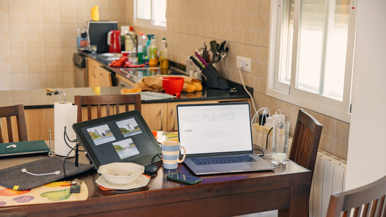 cluttered kitchen/eat-in area