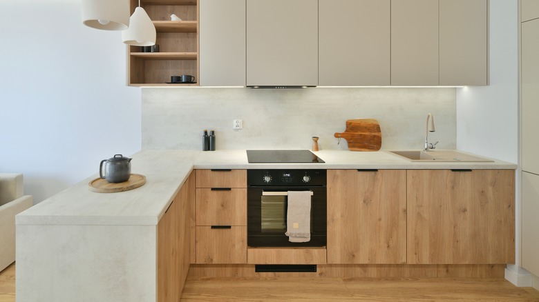Oak cabinets with white counters