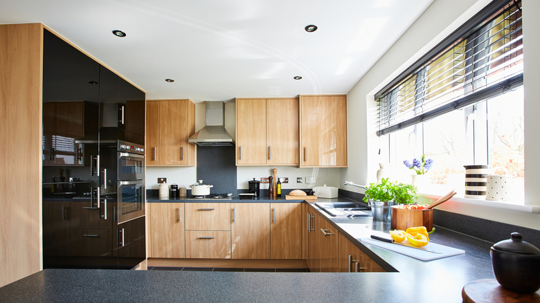 A modern kitchen with blinds