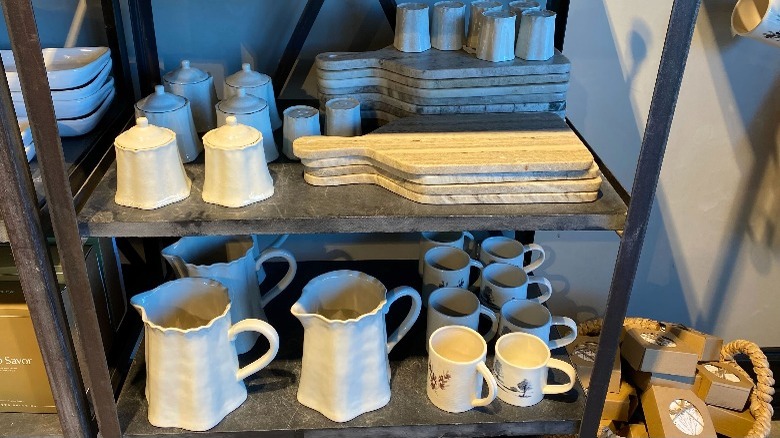 Pottery on shelf with boards 