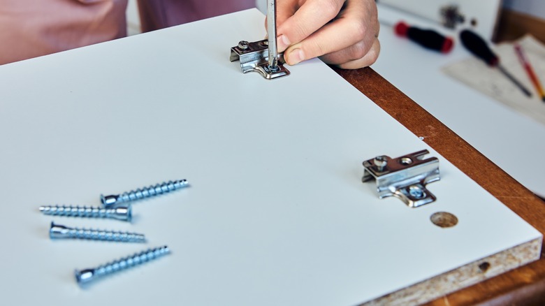 assembling particle board cabinet