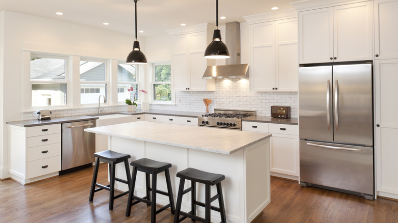 A kitchen with lots of bright lights