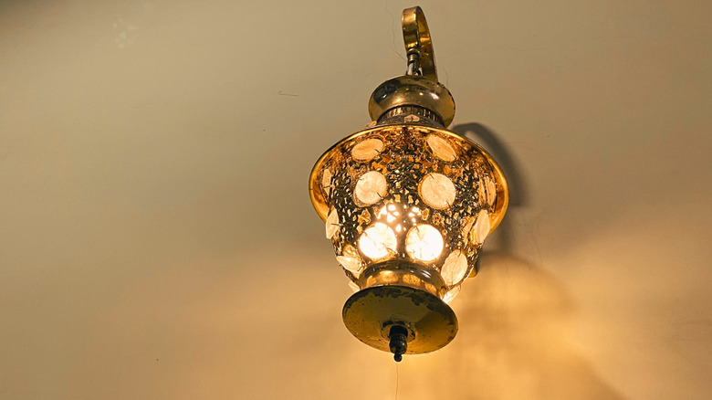 A brass wall sconce