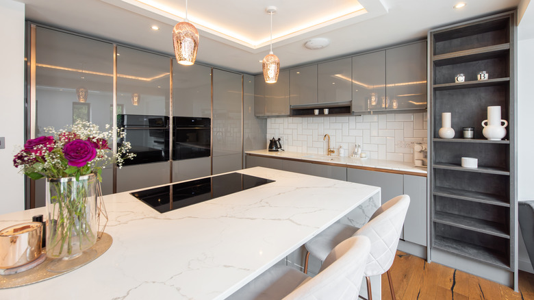 Kitchen with island and marble countertops