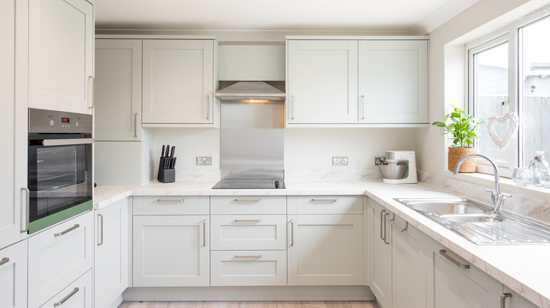 White kitchen with cabinets and drawer pulls