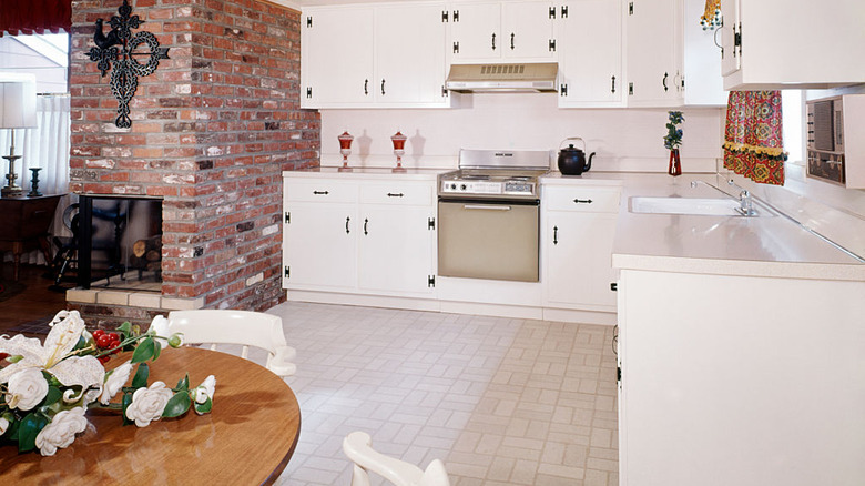 Kitchen with white cabinets and ample open space