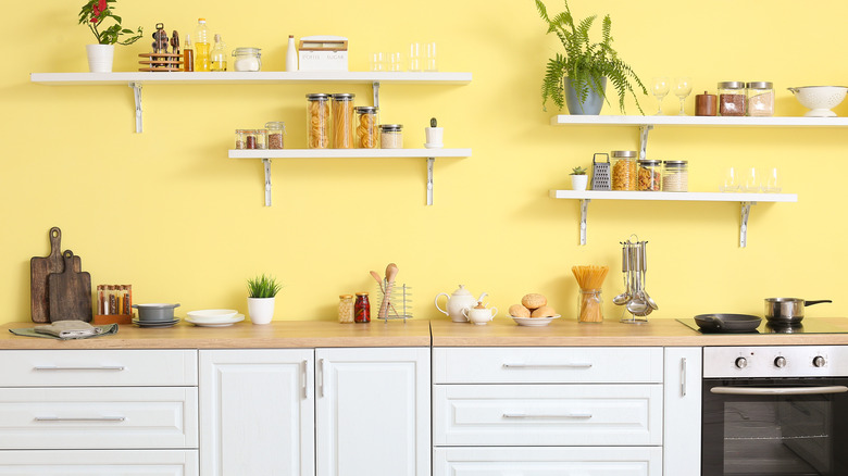 yellow kitchen with open shelving