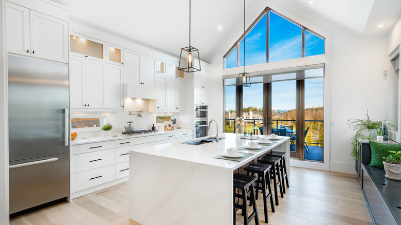 white kitchen with wood flooring