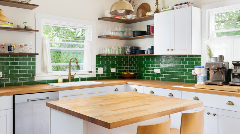 green tile open layout kitchen