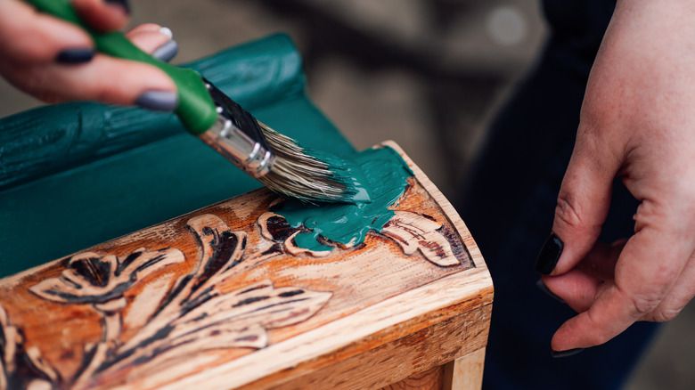 painting cabinet with green paint