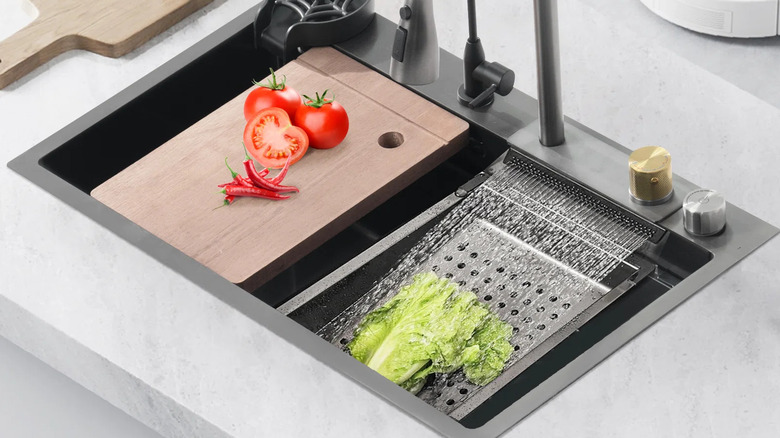 Marble kitchen sink with vegetables washing in it