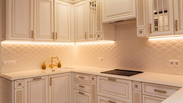 White kitchen with integrated lighting