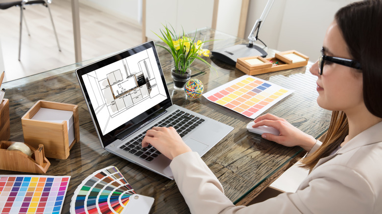 A designer working on a kitchen design