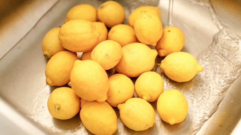 yellow lemons in a sink