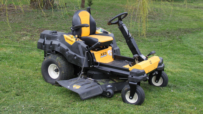 Cub Cadet riding mower sitting in the middle of the lawn