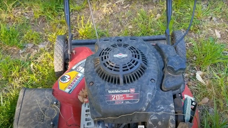 Yard Machines walk-behind mower in the yard