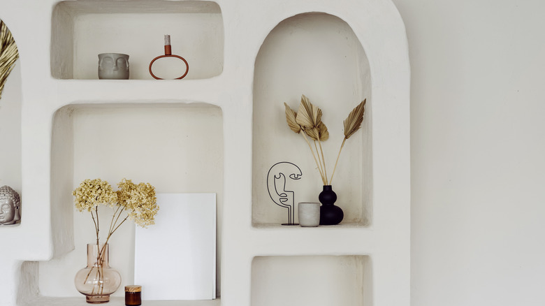 White bookcase with an arch