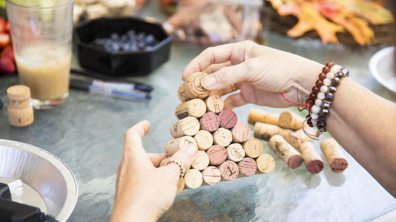 Woman crafting with wine corks